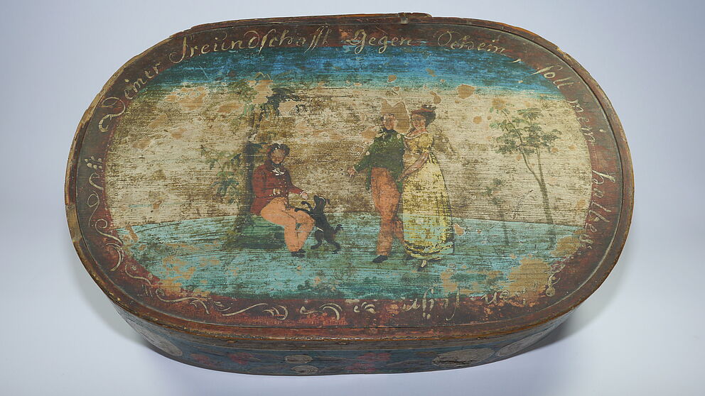 Small painted chipboard box against a white background